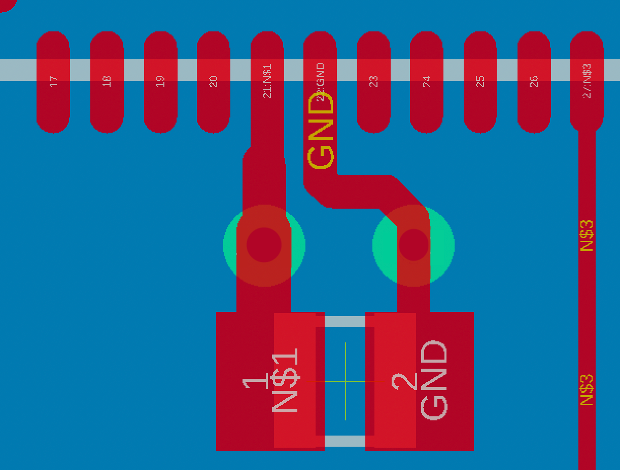 This image illustrates how the left trace gets thinner as it merges into the IC pin. The figure also depicts how vias can be placed between a decoupling capacitor and the supply pins.<